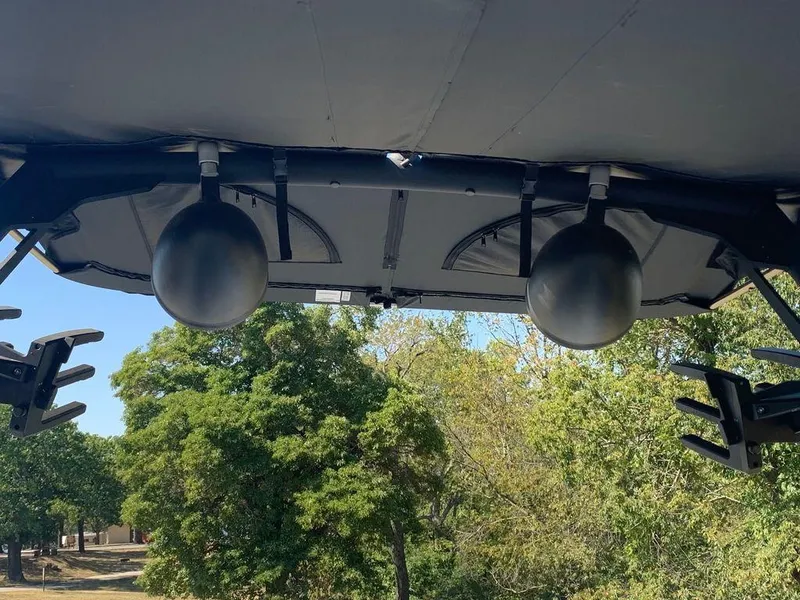 Slide: The Image of 2023 Axis T250 boat tower speakers and wakeboard racks with trees in the background. - 5