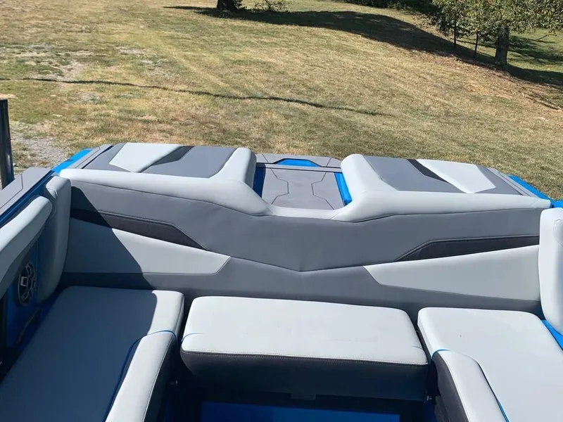 Slide: The Image of 2023 Axis T250 boat interior with gray and blue seating. - 6