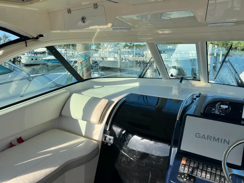 Slide: The Image of Interior of 2014 Pursuit 345 OS boat with Garmin navigation system. - 28