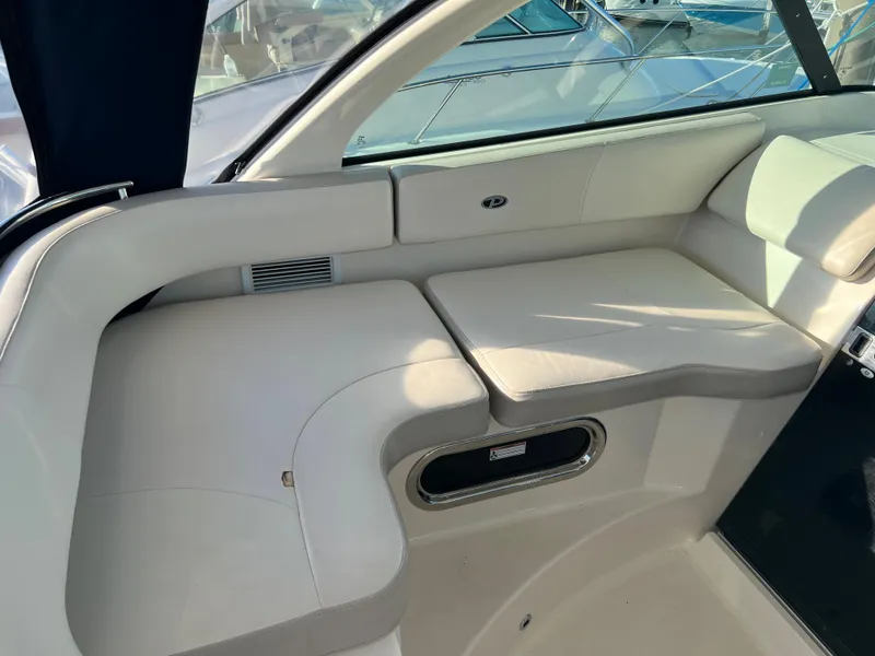 Slide: The Image of 2014 Pursuit 345 OS boat interior seating area. - 29