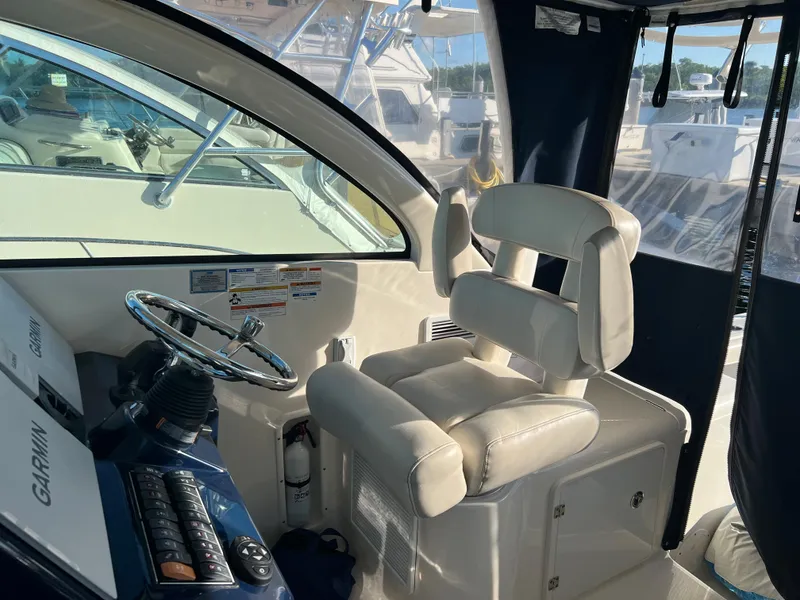 Slide: The Image of 2014 Pursuit 345 OS helm with Garmin electronics and plush captain's chair. - 37
