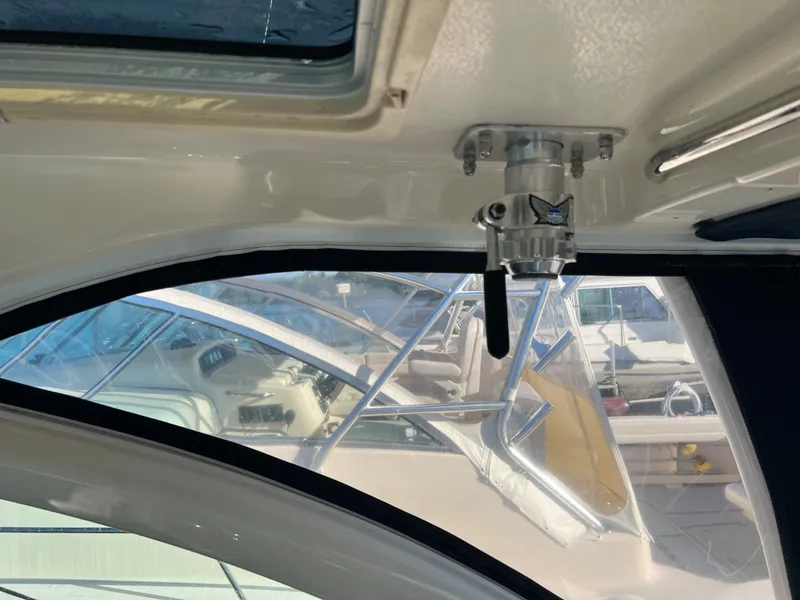 Slide: The Image of Interior view of 2014 Pursuit 345 OS boat with window and control panel. - 40
