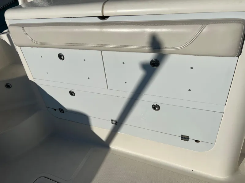 Slide: The Image of Storage compartments on a 2014 Pursuit 345 OS boat. - 48