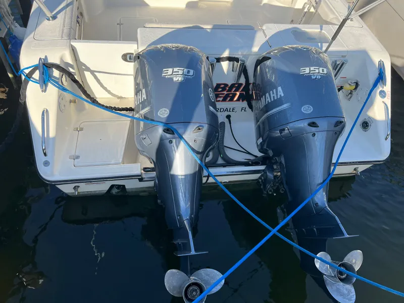 Slide: The Image of 2014 Pursuit 345 OS boat with twin Yamaha 350 outboard engines docked. - 5