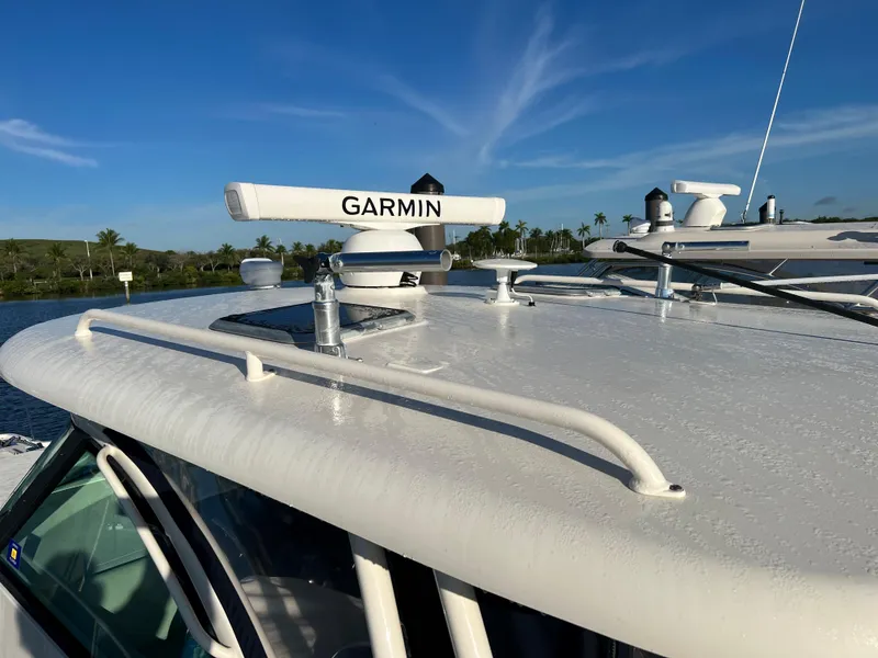 Slide: The Image of 2014 Pursuit 345 OS boat with Garmin radar on the roof. - 7