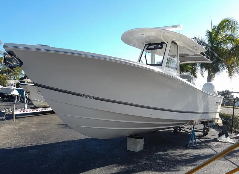 The Image of 2024 Regulator 31 boat on display in a marina. - 0