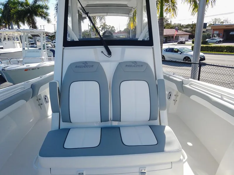 Slide: The Image of 2024 Regulator 31 boat interior with dual seats and console. - 12
