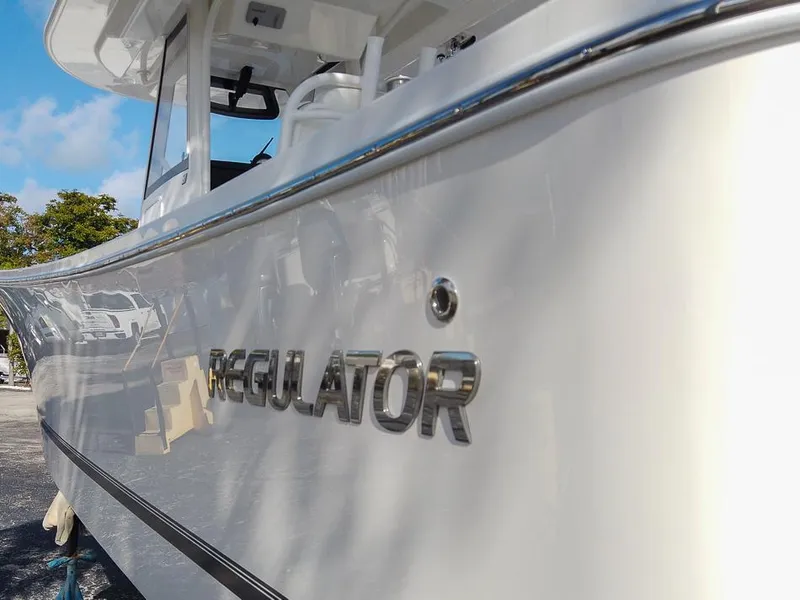 Slide: The Image of 2024 Regulator 31 boat side view with logo. - 5