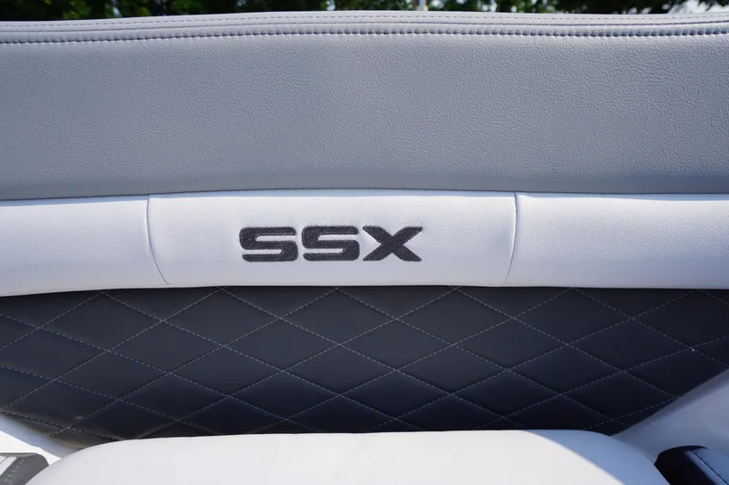 Slide: The Image of 2025 Chaparral 267 SSX boat interior with spacious seating and modern design. - 19