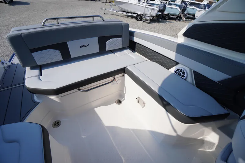 Slide: The Image of 2025 Chaparral 267 SSX boat interior with sleek seating and modern design. - 49