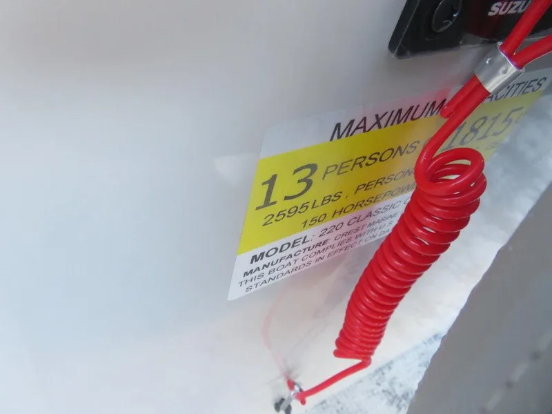 Slide: The Image of 2023 Crest Classic DLX 220 SLSC CPT DLX capacity label, 13 persons, 2695 lbs, 150 horsepower - 11