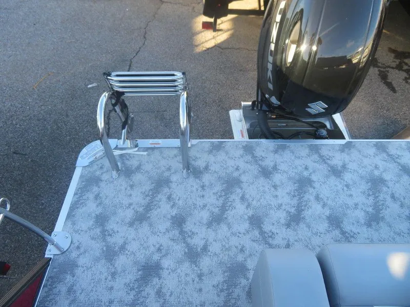 Slide: The Image of 2023 Crest Classic DLX 220 SLSC CPT DLX boat with motor and swim ladder. - 15