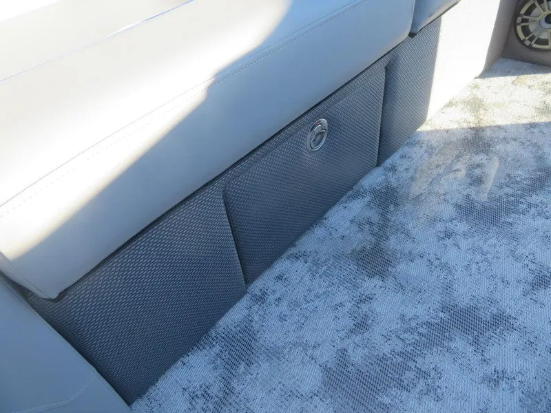 Slide: The Image of 2023 Crest Classic DLX 220 SLSC CPT DLX boat interior seating and storage. - 18