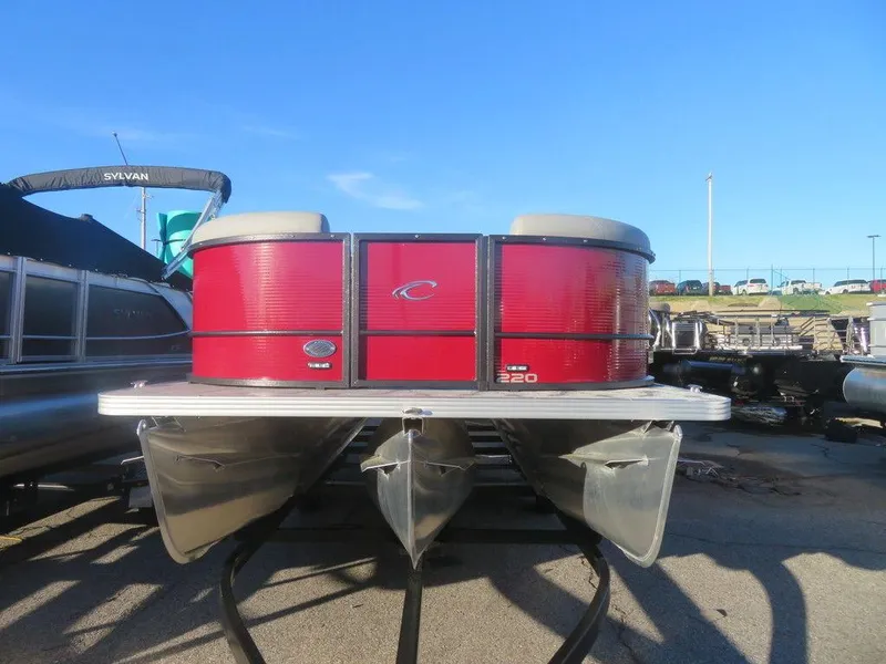 Slide: The Image of 2023 Crest Classic DLX 220 SLSC CPT DLX pontoon boat, front view, red exterior. - 5