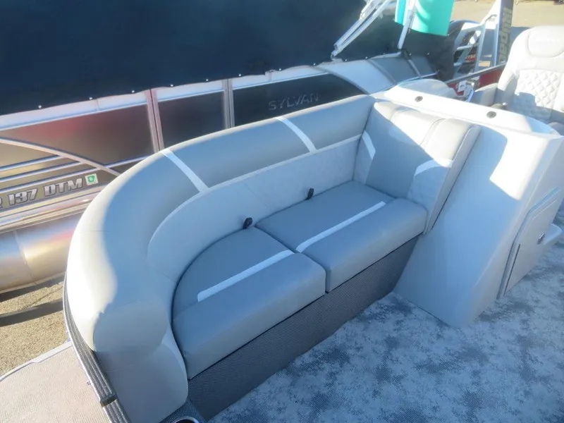 Slide: The Image of 2023 Crest Classic DLX 220 SLSC CPT DLX boat interior with gray seating. - 7