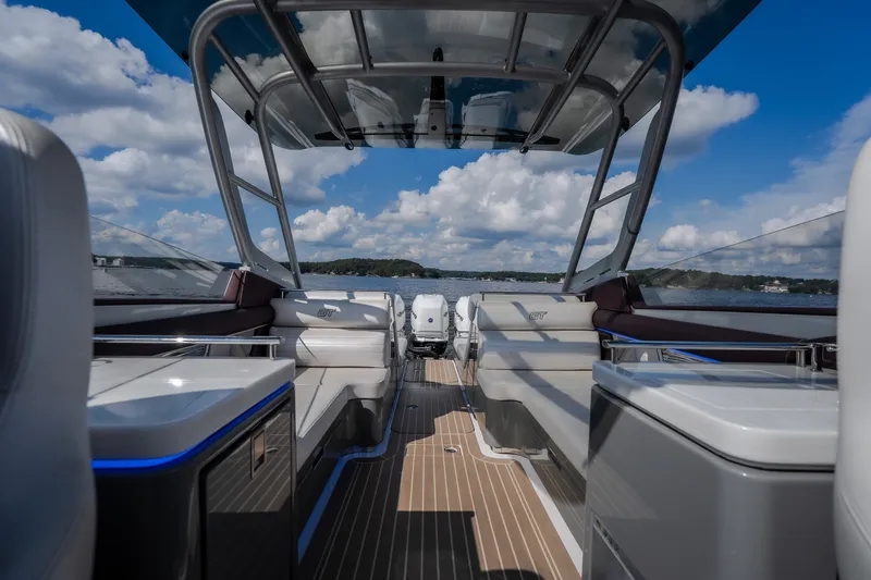 Slide: The Image of 2019 Donzi 41 GT boat interior with sleek seating and open water view. - 25