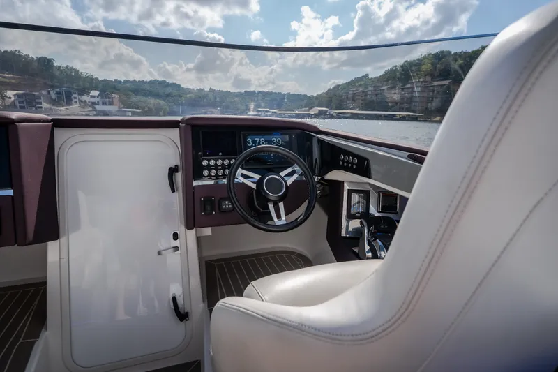 Slide: The Image of Interior cockpit of 2019 Donzi 41 GT boat with steering wheel and controls. - 43