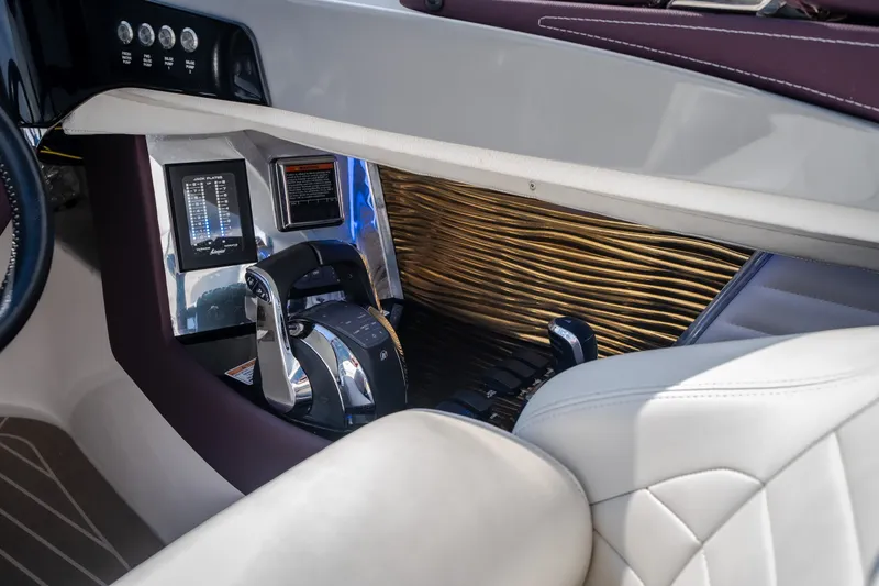 Slide: The Image of Interior of 2019 Donzi 41 GT boat, featuring sleek controls and luxurious seating. - 44
