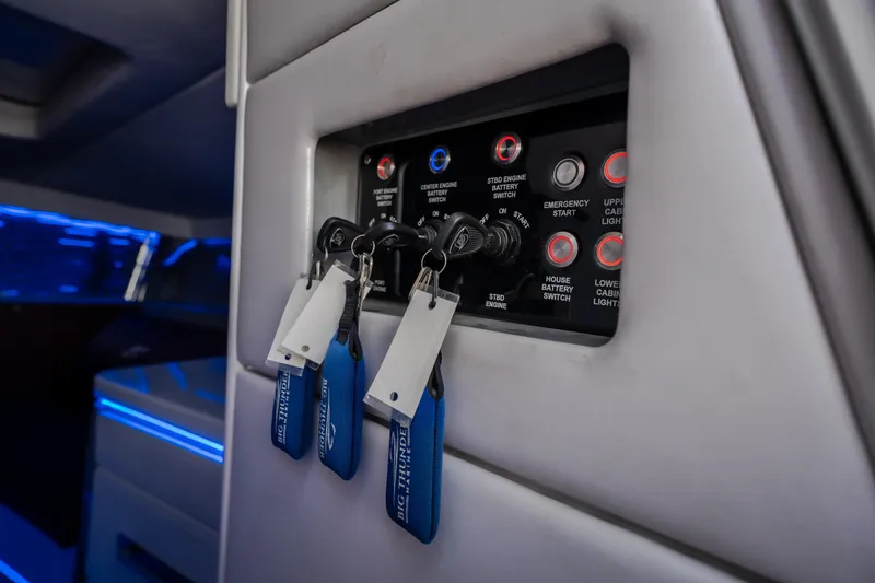 Slide: The Image of Control panel of a 2019 Donzi 41 GT boat with keys and switches. - 52