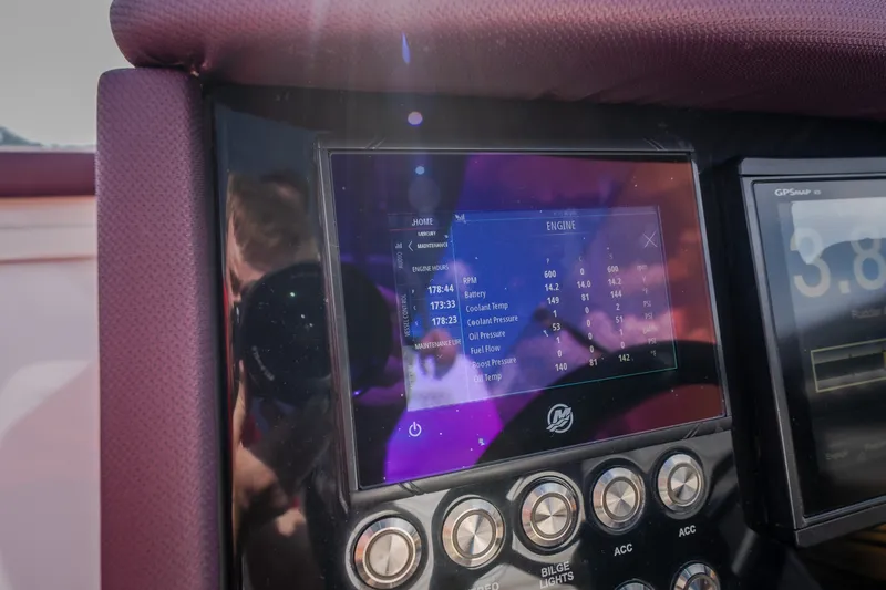 Slide: The Image of Dashboard of a 2019 Donzi 41 GT boat displaying engine metrics. - 48