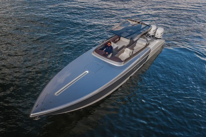 Slide: The Image of 2019 Donzi 41 GT boat cruising on open water, showcasing sleek design and luxury features. - 4