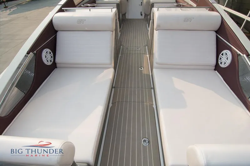 Slide: The Image of 2019 Donzi 41 GT boat interior with white seating and Big Thunder Marine logo. - 27