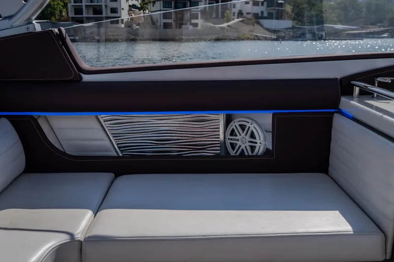 Slide: The Image of Interior of 2019 Donzi 41 GT boat with sleek seating and modern speaker design. - 33