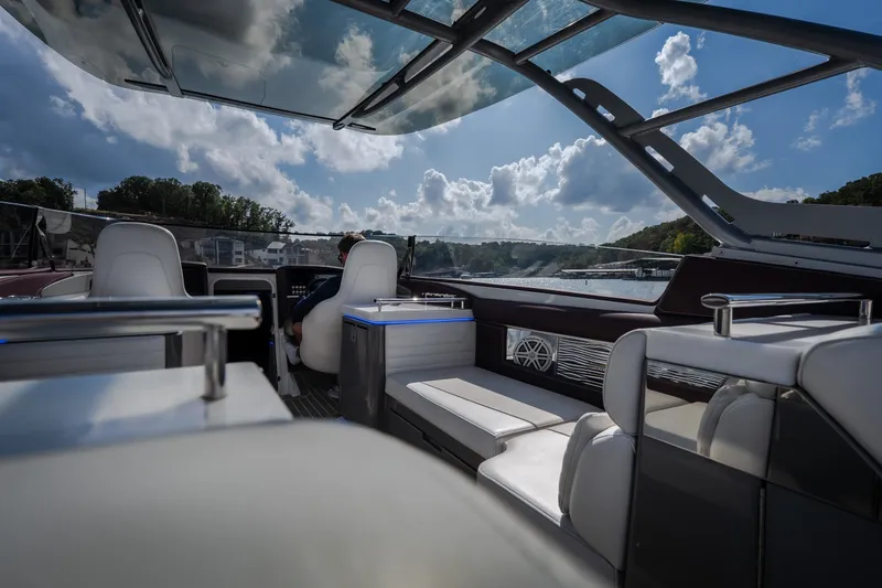 Slide: The Image of Interior view of a 2019 Donzi 41 GT boat with modern seating and panoramic windows. - 35