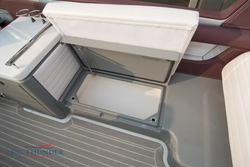 Slide: The Image of 2019 Donzi 41 GT boat interior storage compartment with white and gray seating. - 38