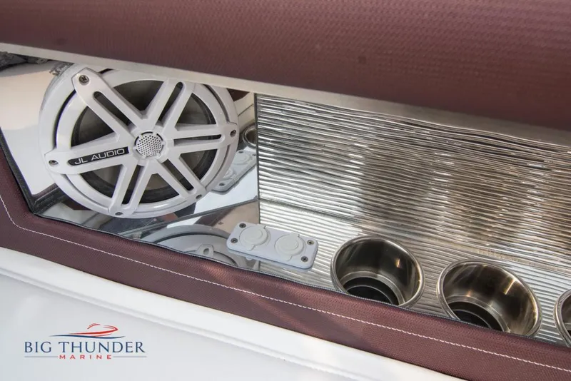 Slide: The Image of 2019 Donzi 41 GT boat interior with JL Audio speaker and cup holders. - 39