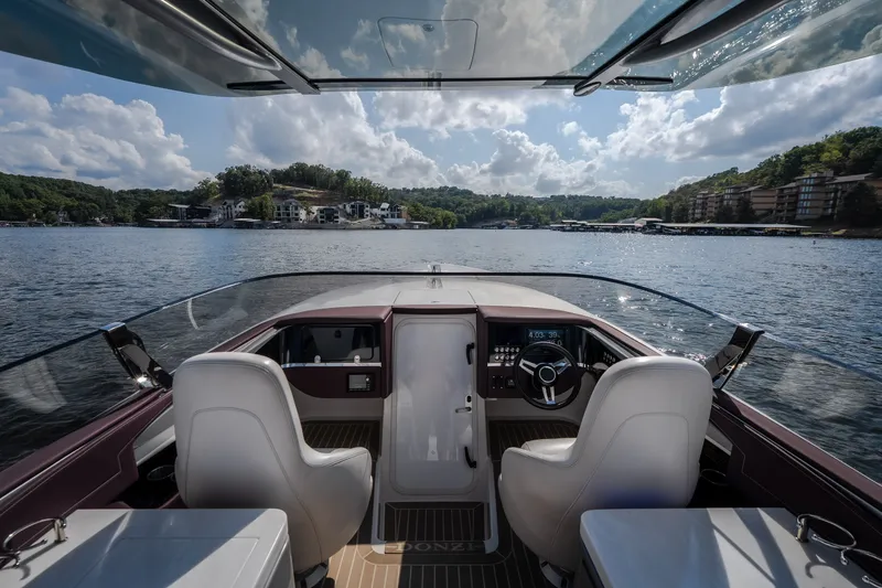 Slide: The Image of 2019 Donzi 41 GT boat interior with lake view, featuring sleek design and modern controls. - 42