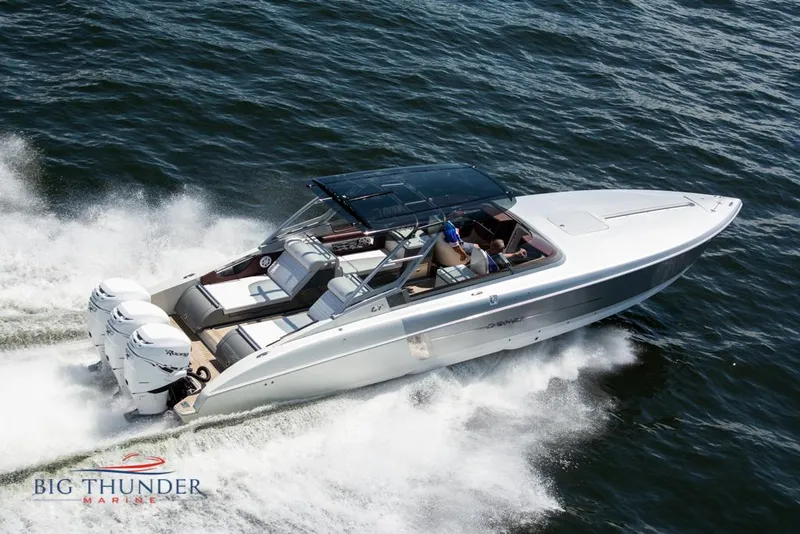 Slide: The Image of 2019 Donzi 41 GT speedboat cruising on water, Big Thunder Marine logo. - 4