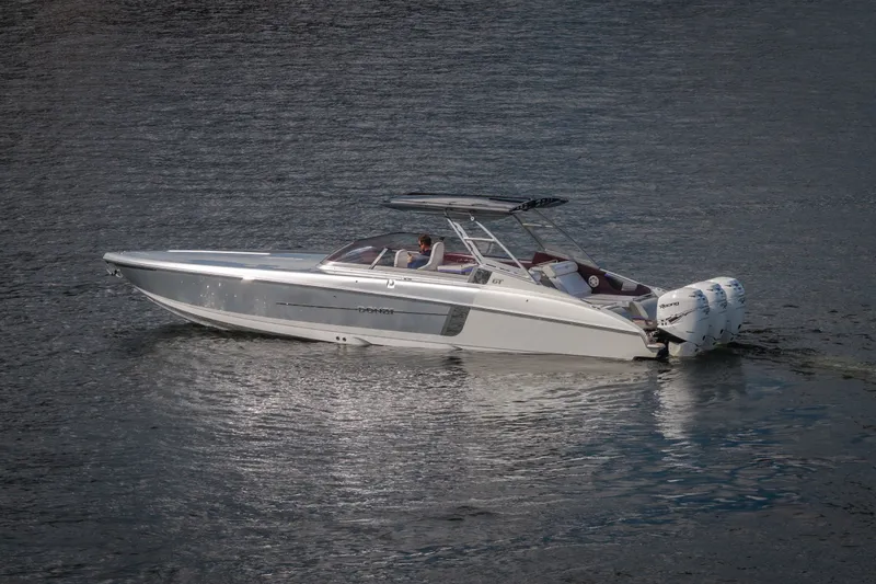 The Image of 2019 Donzi 41 GT boat on calm water, featuring sleek design and powerful engines. - 0