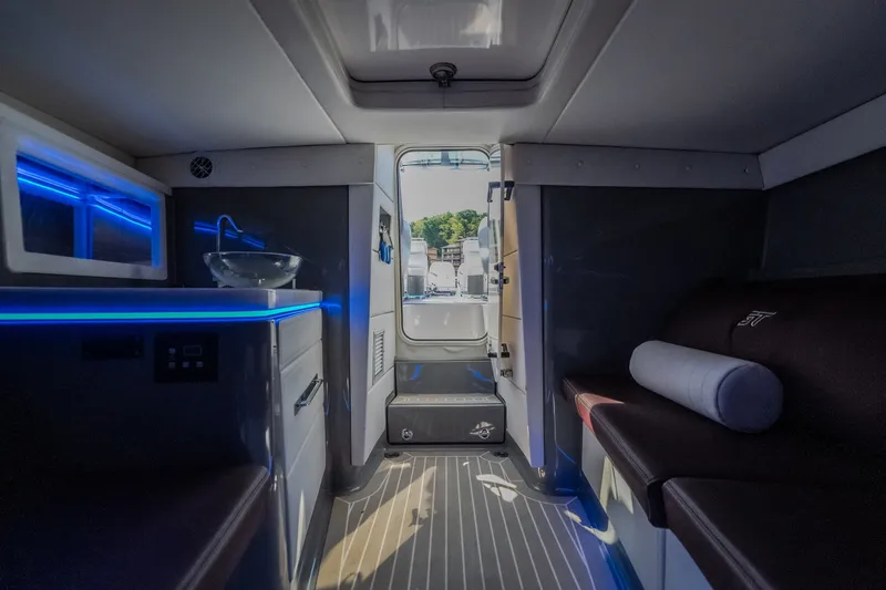 Slide: The Image of Interior of 2019 Donzi 41 GT boat with modern seating and ambient lighting. - 57