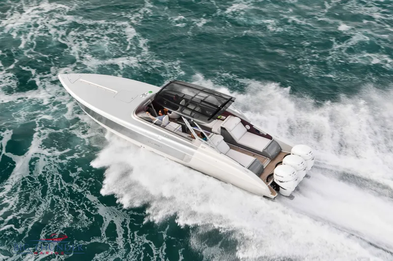 Slide: The Image of 2019 Donzi 41 GT speedboat cruising on open water. - 5