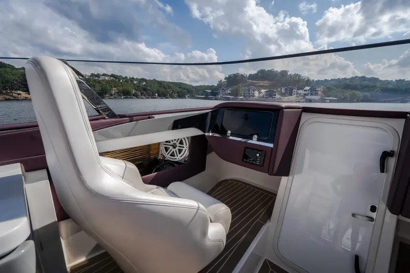 Slide: The Image of Interior of a 2019 Donzi 41 GT boat with luxurious seating and scenic lake view. - 46