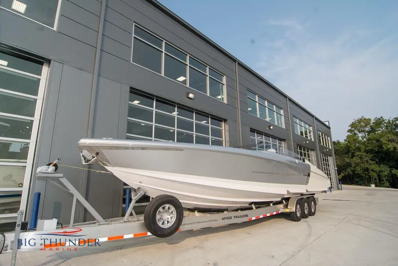 Slide: The Image of 2019 Donzi 41 GT boat on trailer outside Big Thunder Marine building. - 7