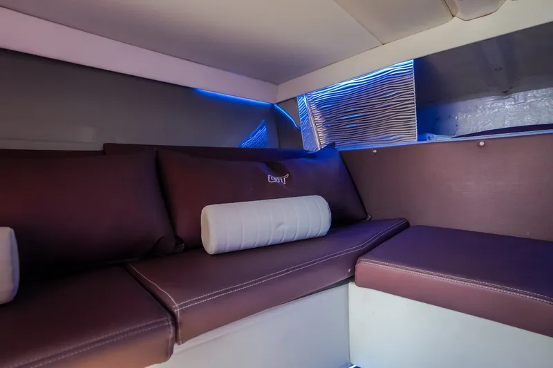 Slide: The Image of Luxurious interior of 2019 Donzi 41 GT boat with plush seating and ambient lighting. - 56