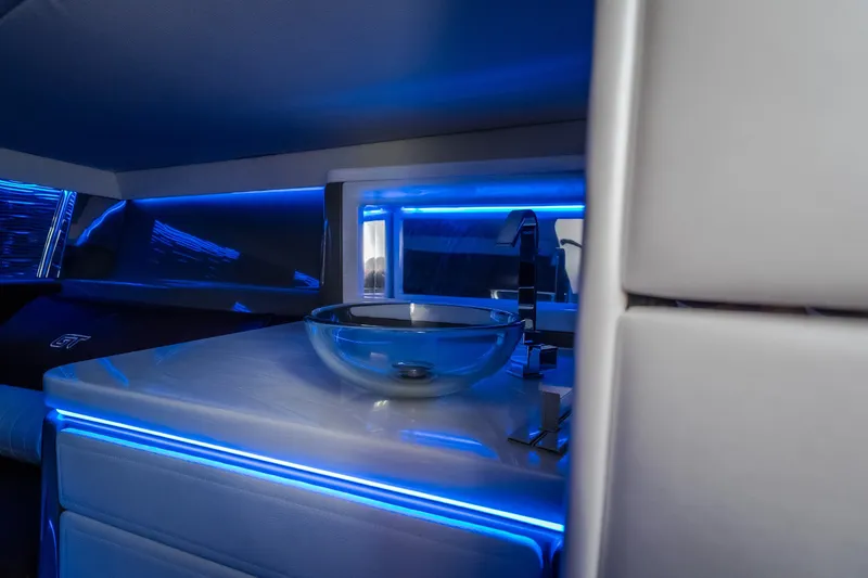Slide: The Image of Interior of 2019 Donzi 41 GT boat with modern sink and blue LED lighting. - 54