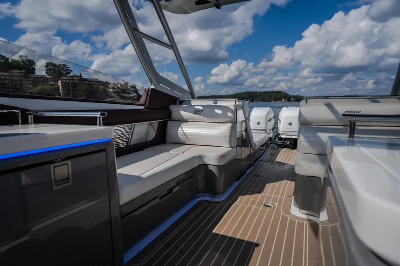 Slide: The Image of 2019 Donzi 41 GT boat interior with luxurious seating and powerful engines. - 28