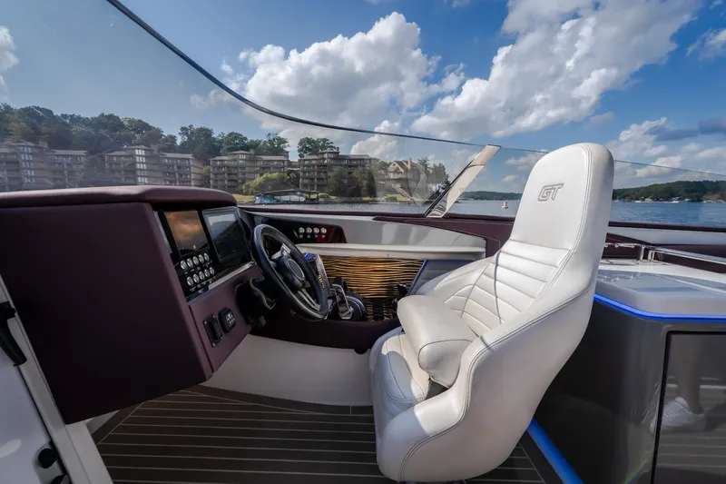 Slide: The Image of Interior of a 2019 Donzi 41 GT boat with luxurious seating and modern controls. - 47