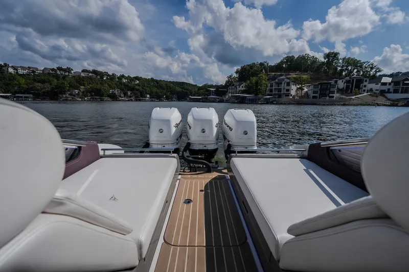 Slide: The Image of 2019 Donzi 41 GT boat with triple engines on a scenic lake. - 17