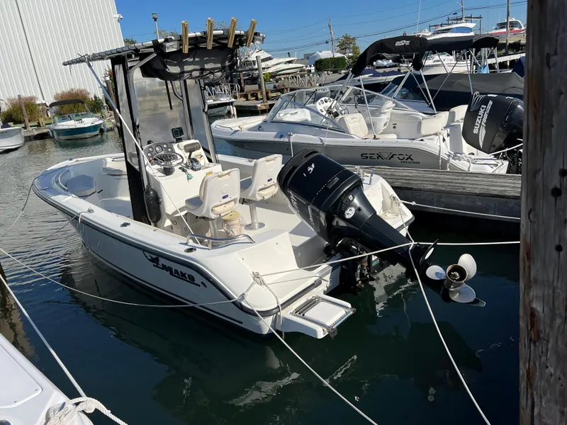 Slide: The Image of 2008 Mako 204 CC boat docked in a marina. - 1