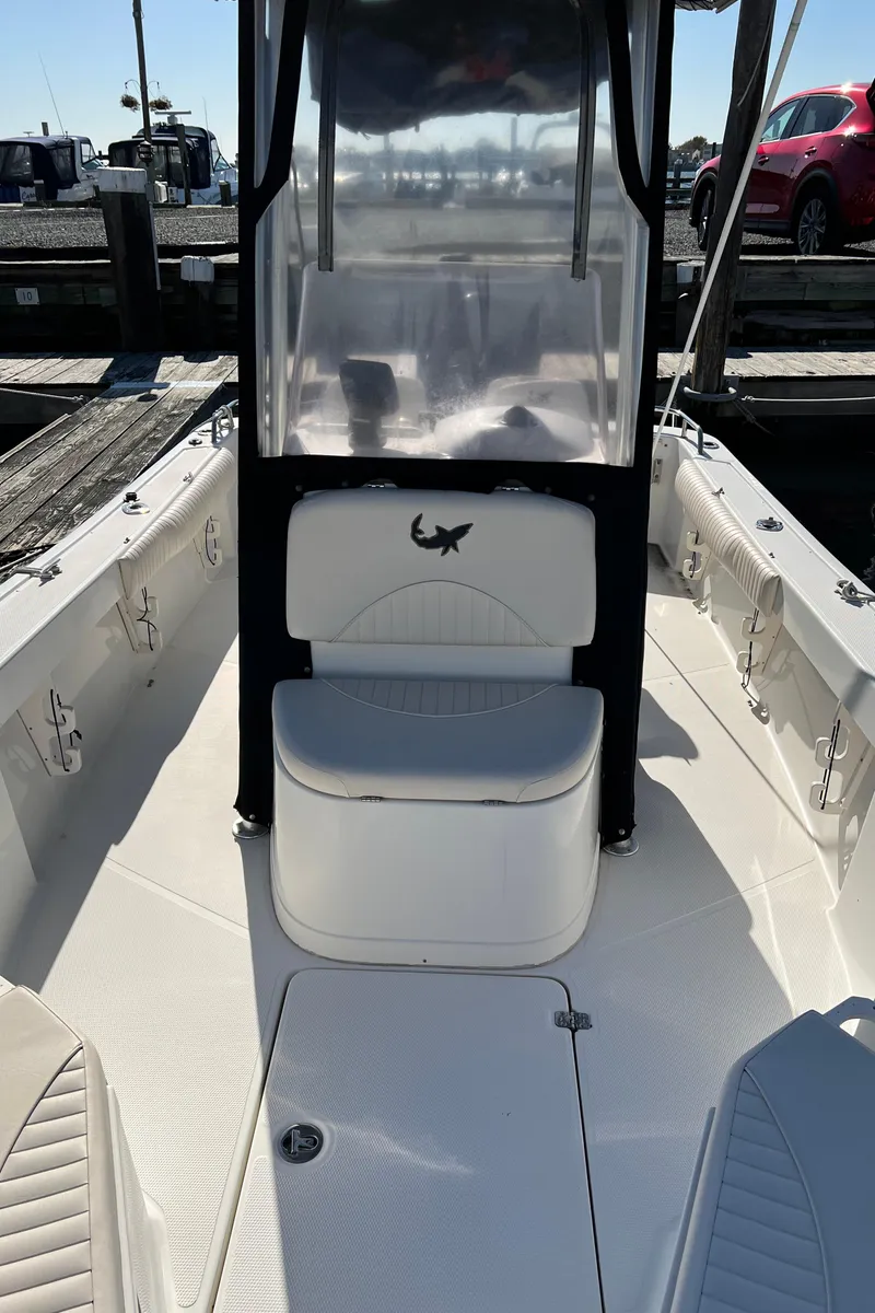 Slide: The Image of 2008 Mako 204 CC center console boat docked at a marina. - 3
