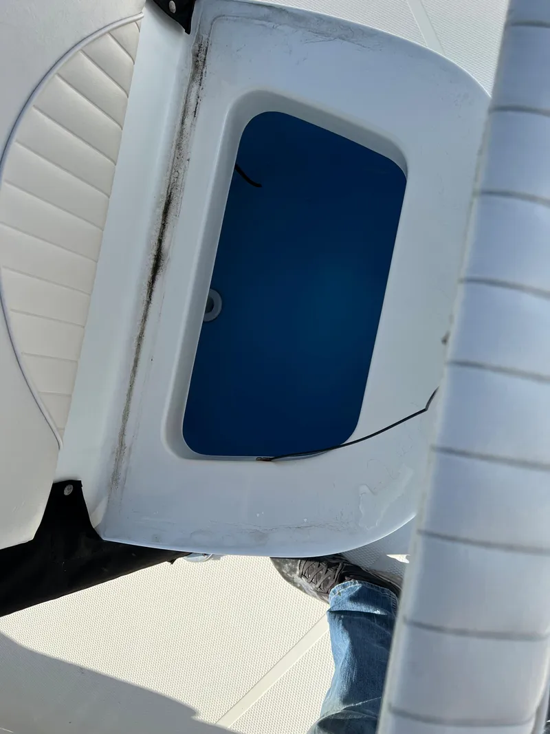 Slide: The Image of Open storage compartment on a 2008 Mako 204 CC boat. - 4