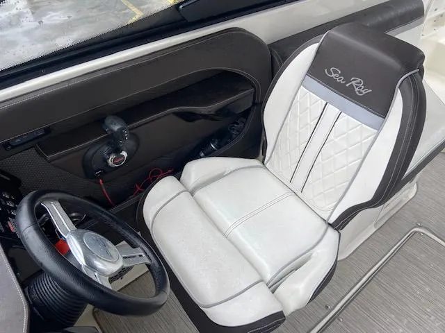 Slide: The Image of Captain's seat and steering wheel of a 2017 Sea Ray 250 SLX boat. - 15