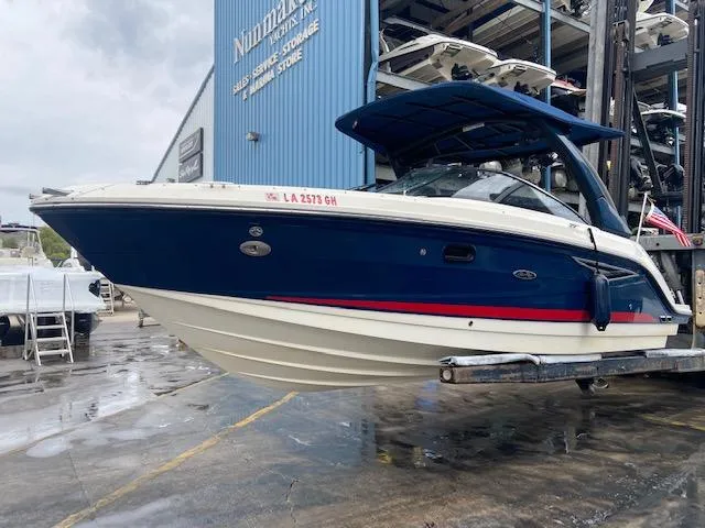 Slide: The Image of 2017 Sea Ray 250 SLX boat in dry storage at a marina. - 3
