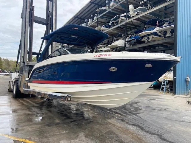 Slide: The Image of 2017 Sea Ray 250 SLX boat in a marina lift. - 4