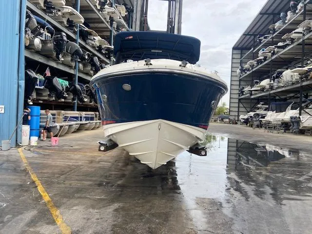Slide: The Image of 2017 Sea Ray 250 SLX boat in storage facility. - 5