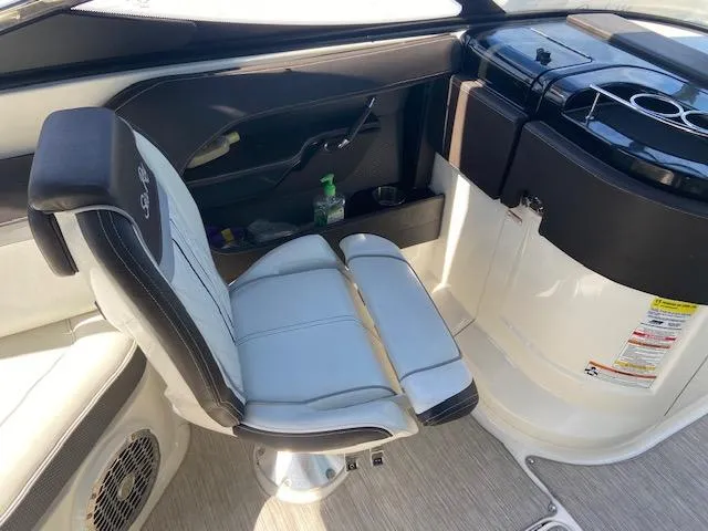 Slide: The Image of 2017 Sea Ray 250 SLX boat interior with captain's chair and control panel. - 9